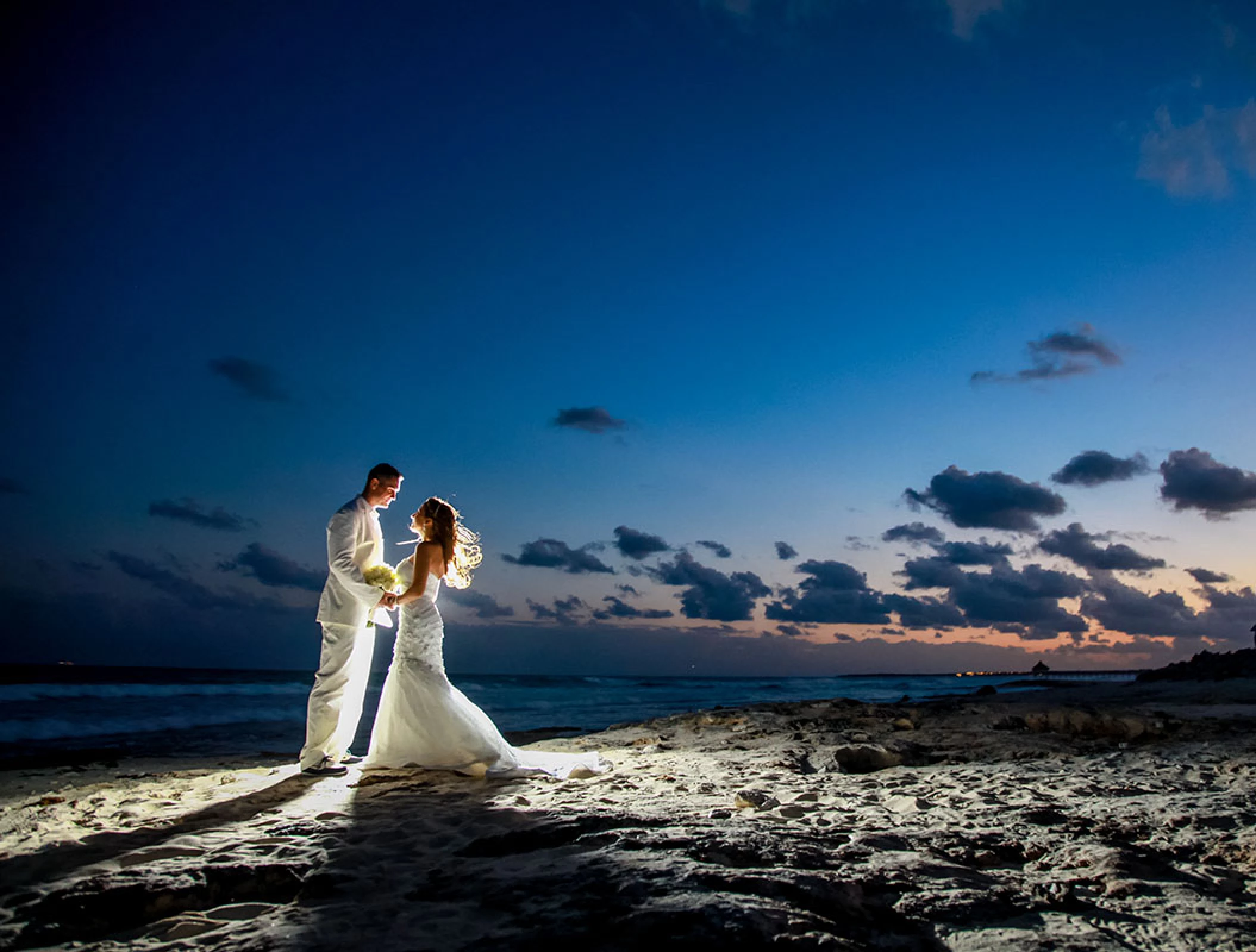 Couple at Beach Stage wedding venue at Hilton Tulum.