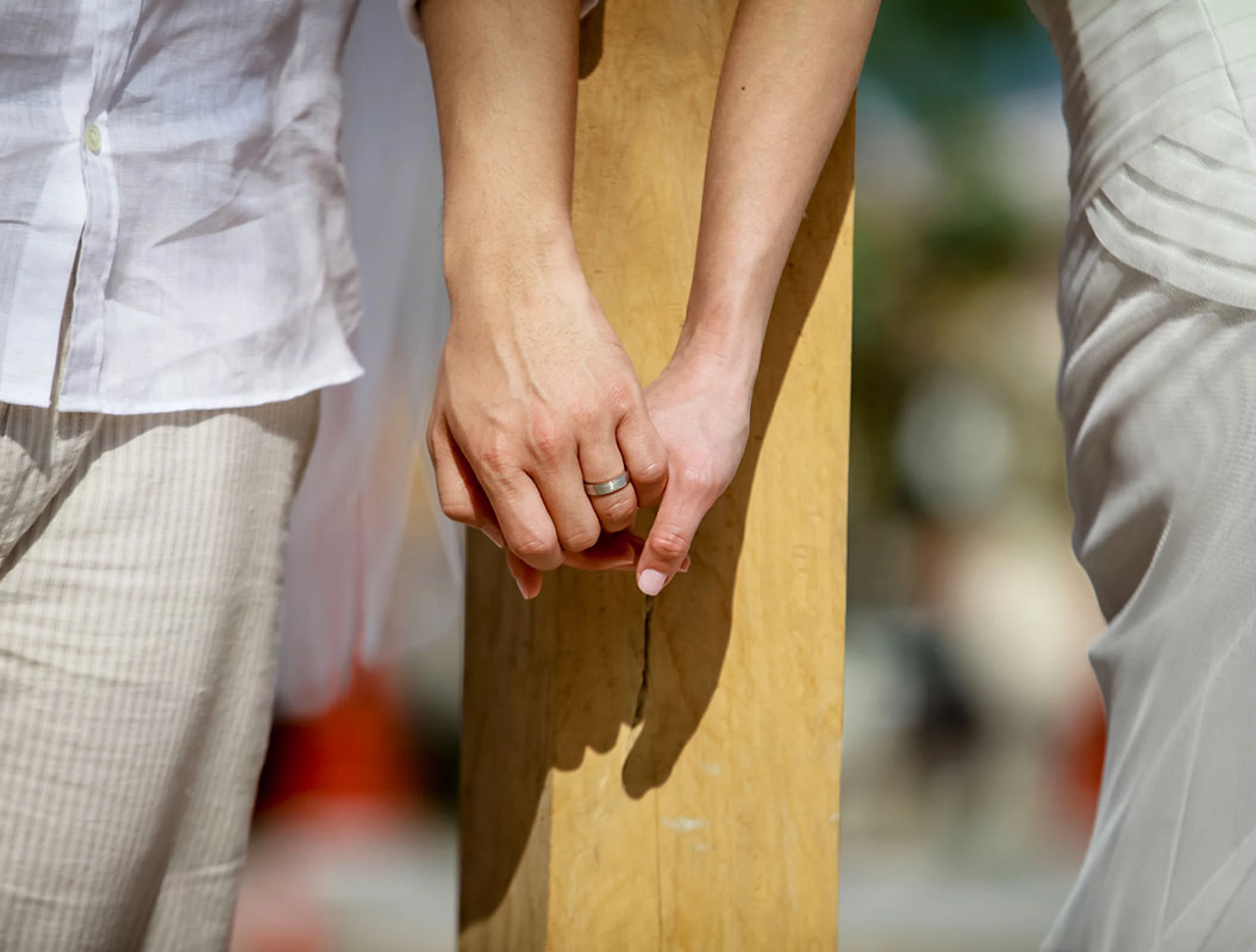 Groom and bride holding hands.