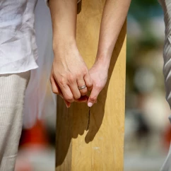 Groom and bride holding hands