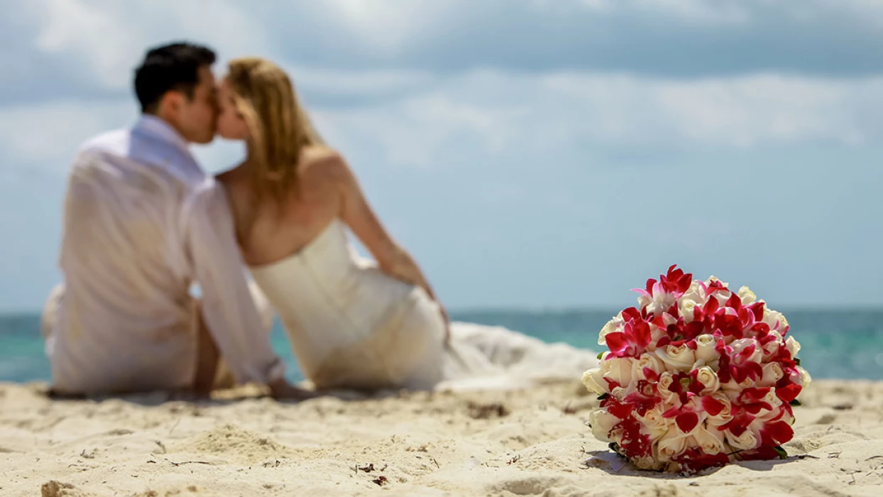 Groom and Bride on the beach at Hilton Tulum.