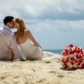 Groom and Bride on the beach at Hilton Tulum.