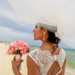 Bride on the beach at Hilton Tulum.