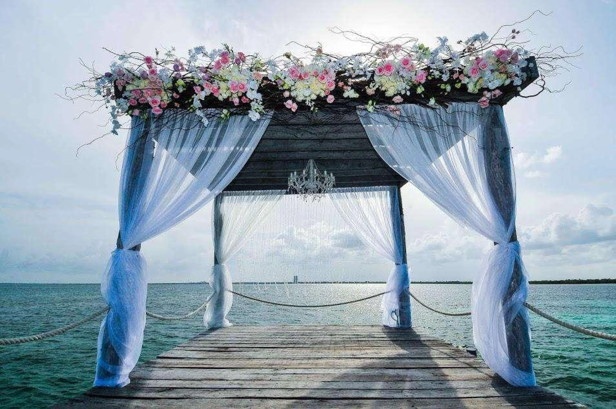 Ceremony decor on The pier wedding venue at Nizuc Resort and Spa