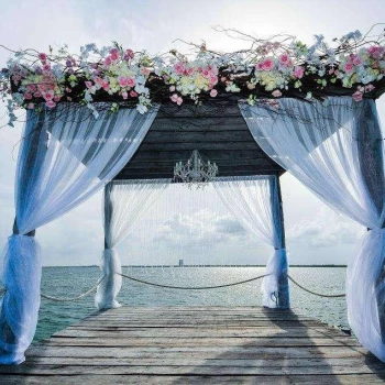 Ceremony decor on The pier wedding venue at Nizuc Resort and Spa