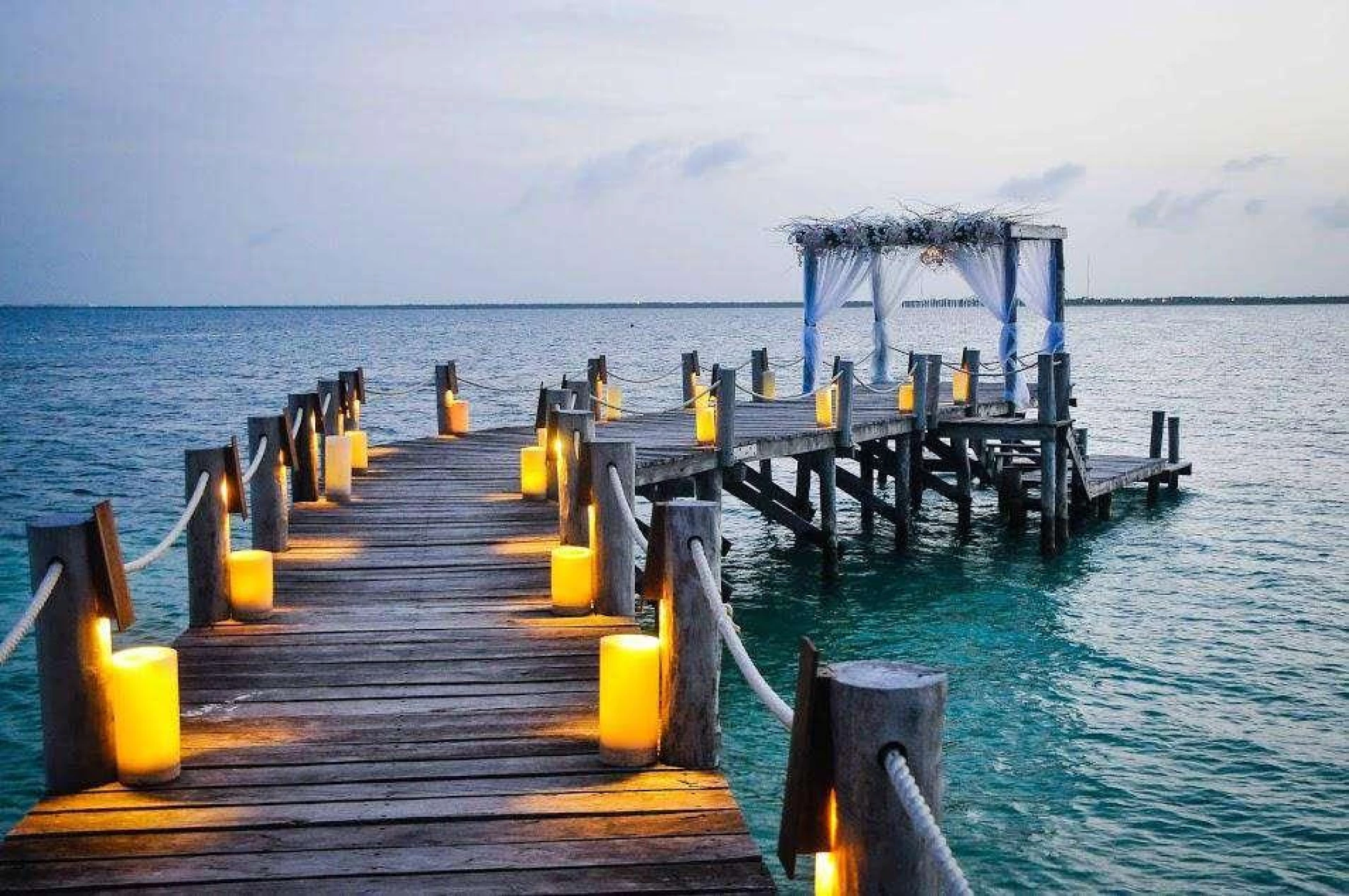 Ceremony decor on The pier wedding venue at Nizuc Resort and Spa