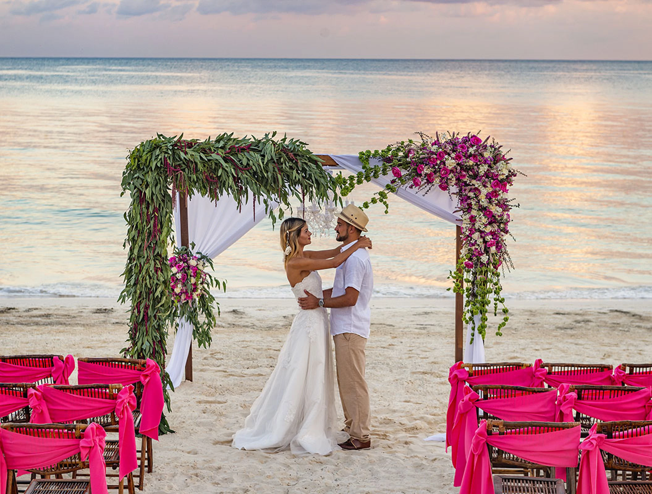 Couple celebrating their Beach Wedding ceremony at Ocean Coral and Turquesa Resort.