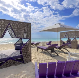 Planet Hollywood Cancun beach wth daybeds and lounge chairs