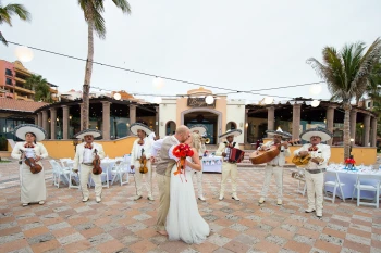 Couple with mariachi band at playa grande resort and grand spa