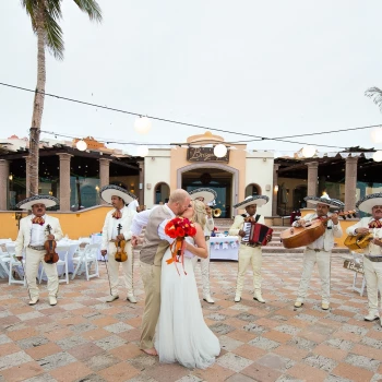 Couple with mariachi band at playa grande resort and grand spa