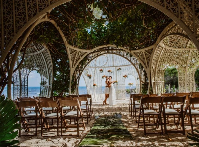 wedding venue at Sandos Caracol with couple at altar