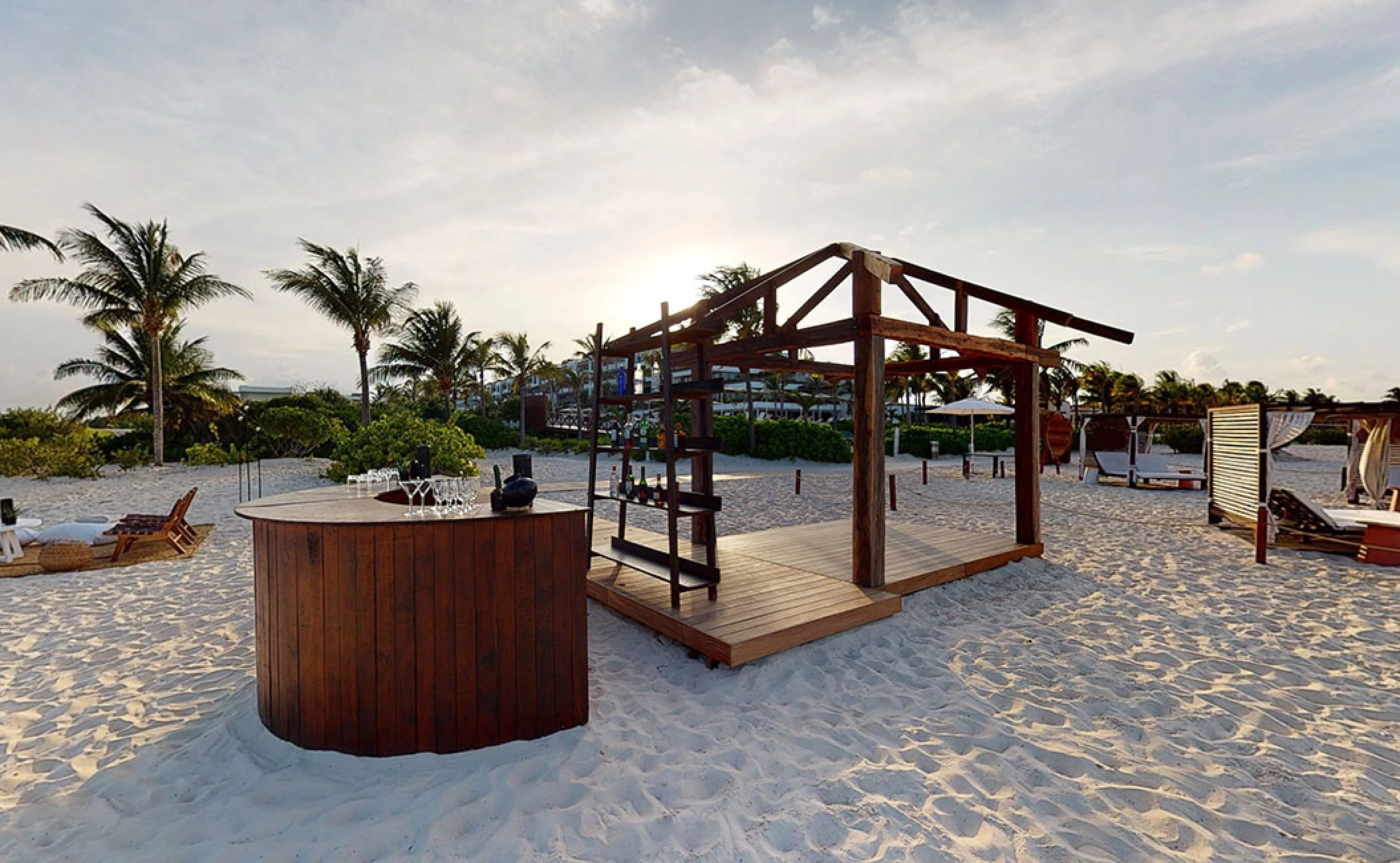 Cocktail setting in beach venue at atelier playa mujeres resort