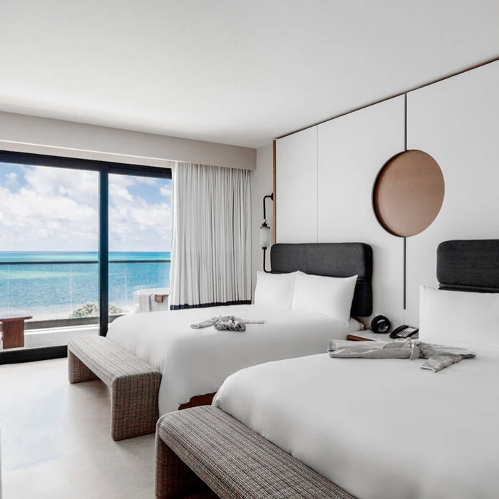 room with double beds at AVA Resort Cancun