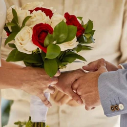 bride and groom holding hands at bahia principe grand coba