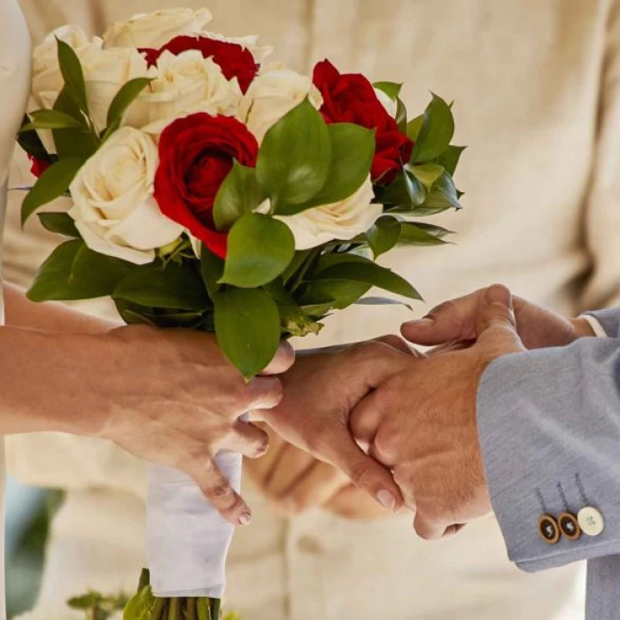 bride and groom holding hands at bahia principe