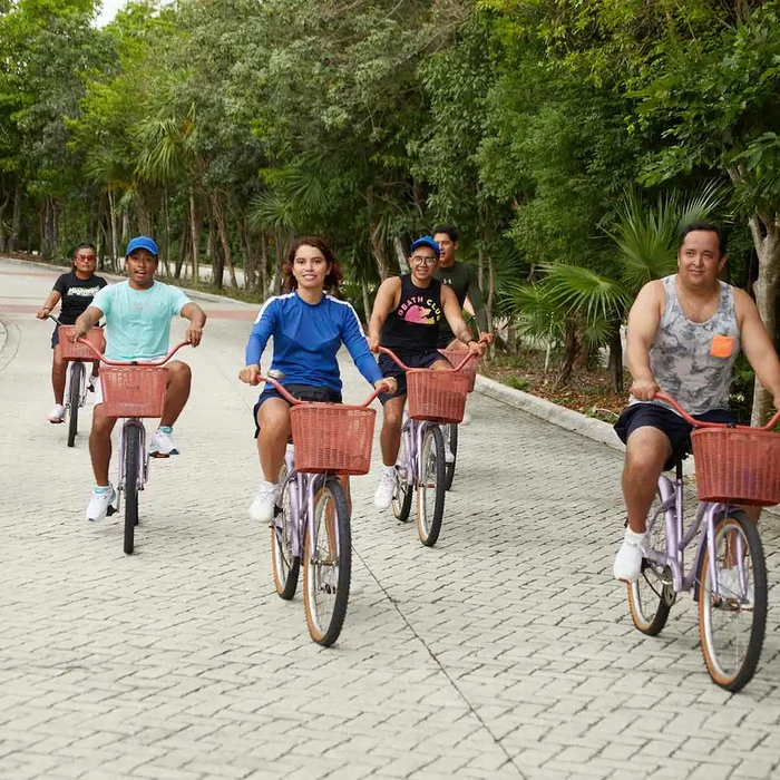 guests cycling at Bahia Principe Luxury Sian Ka’an