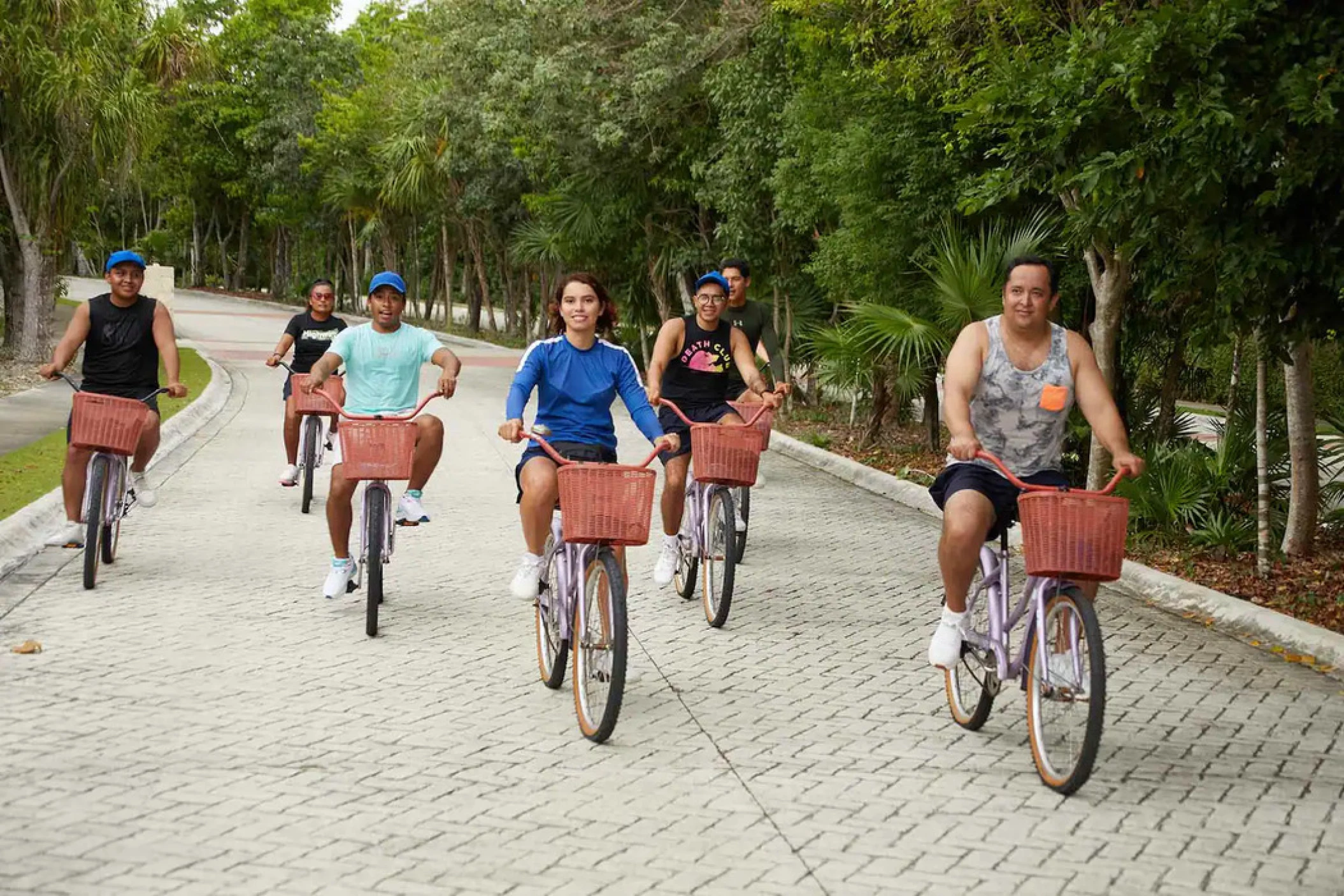 guests cycling at Bahia Principe Luxury Sian Ka’an