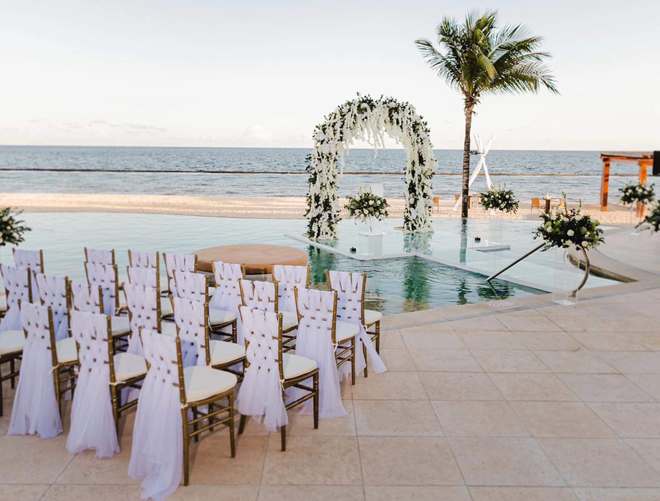 Over the water wedding venue at Breathless Riviera Cancun resort.