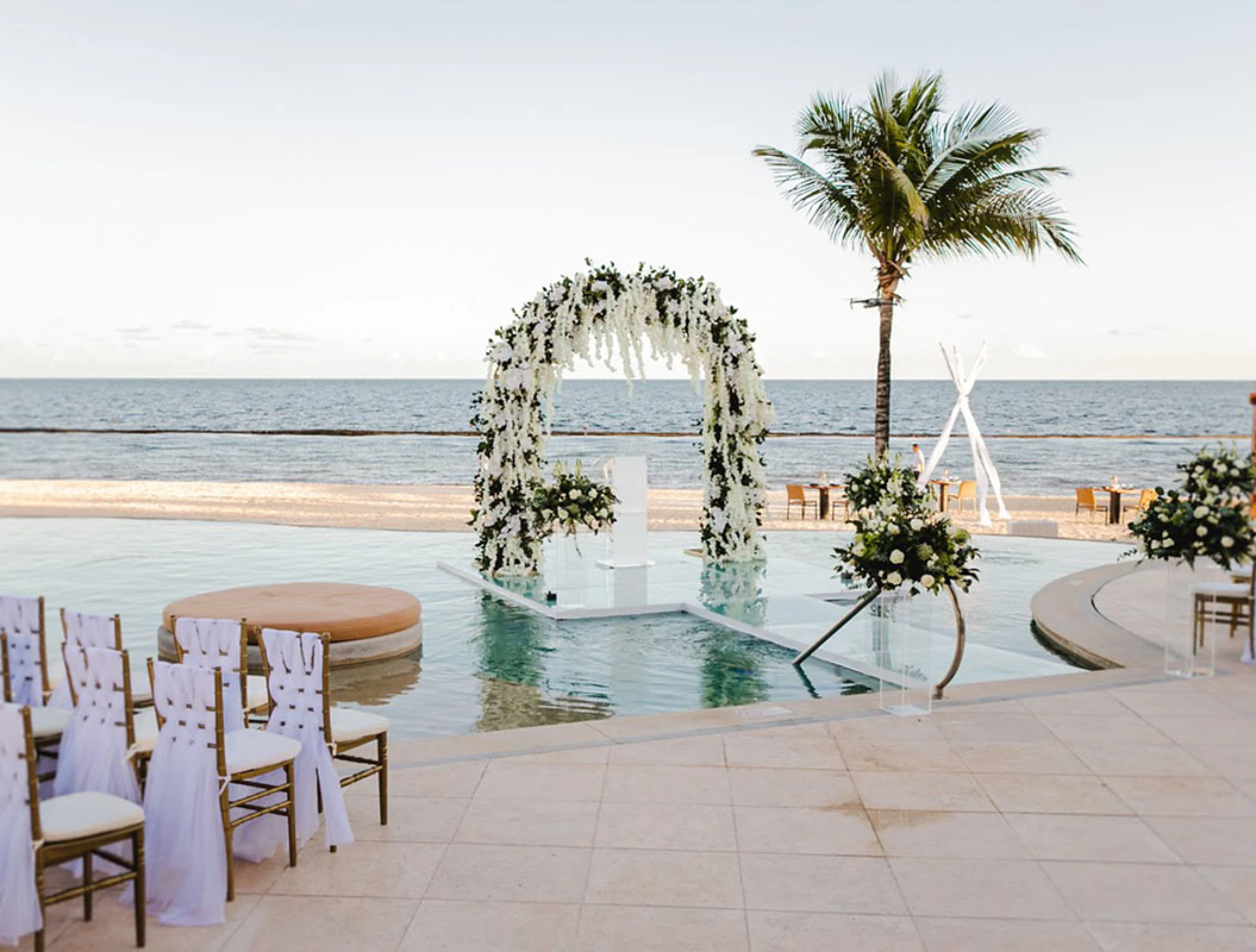 Over the water wedding venue at Breathless Riviera Cancun resort.