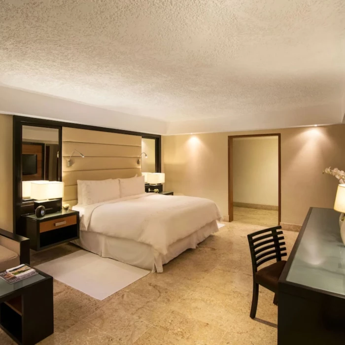 elite room with king bed and amenities at Casa de Campo