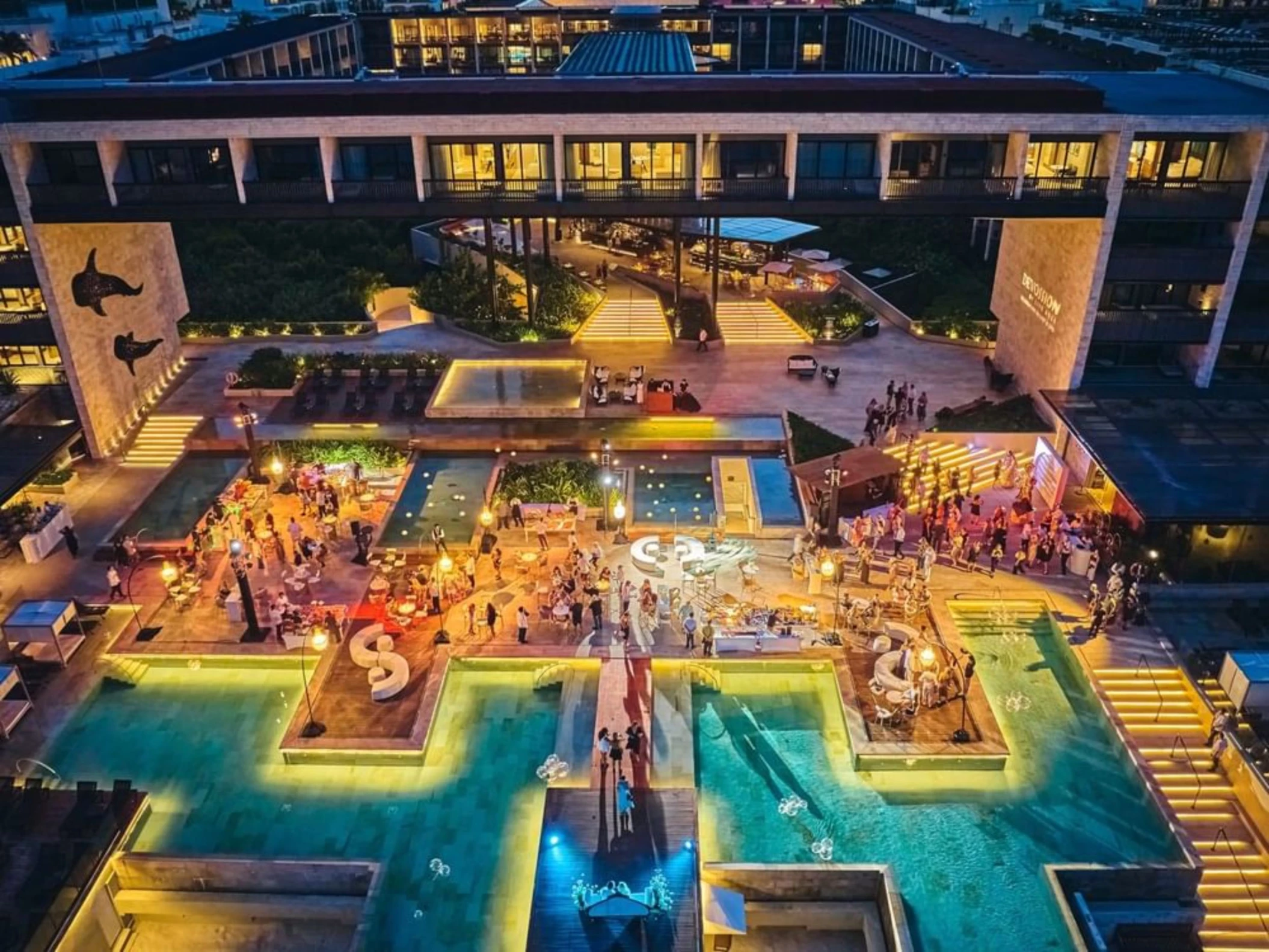 aerial view of Devossion by Live Aqua Playa del Carmen at night