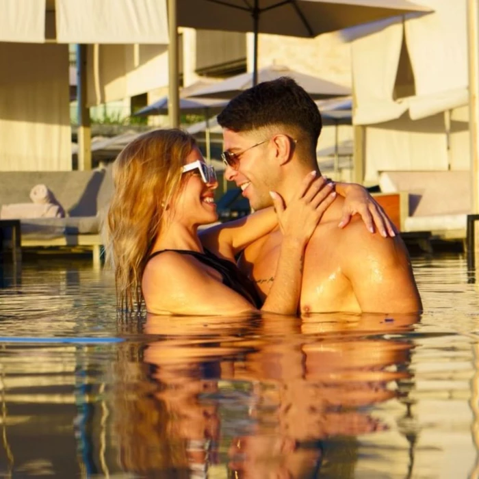 couple in the pool at Devossion by Live Aqua Playa del Carmen