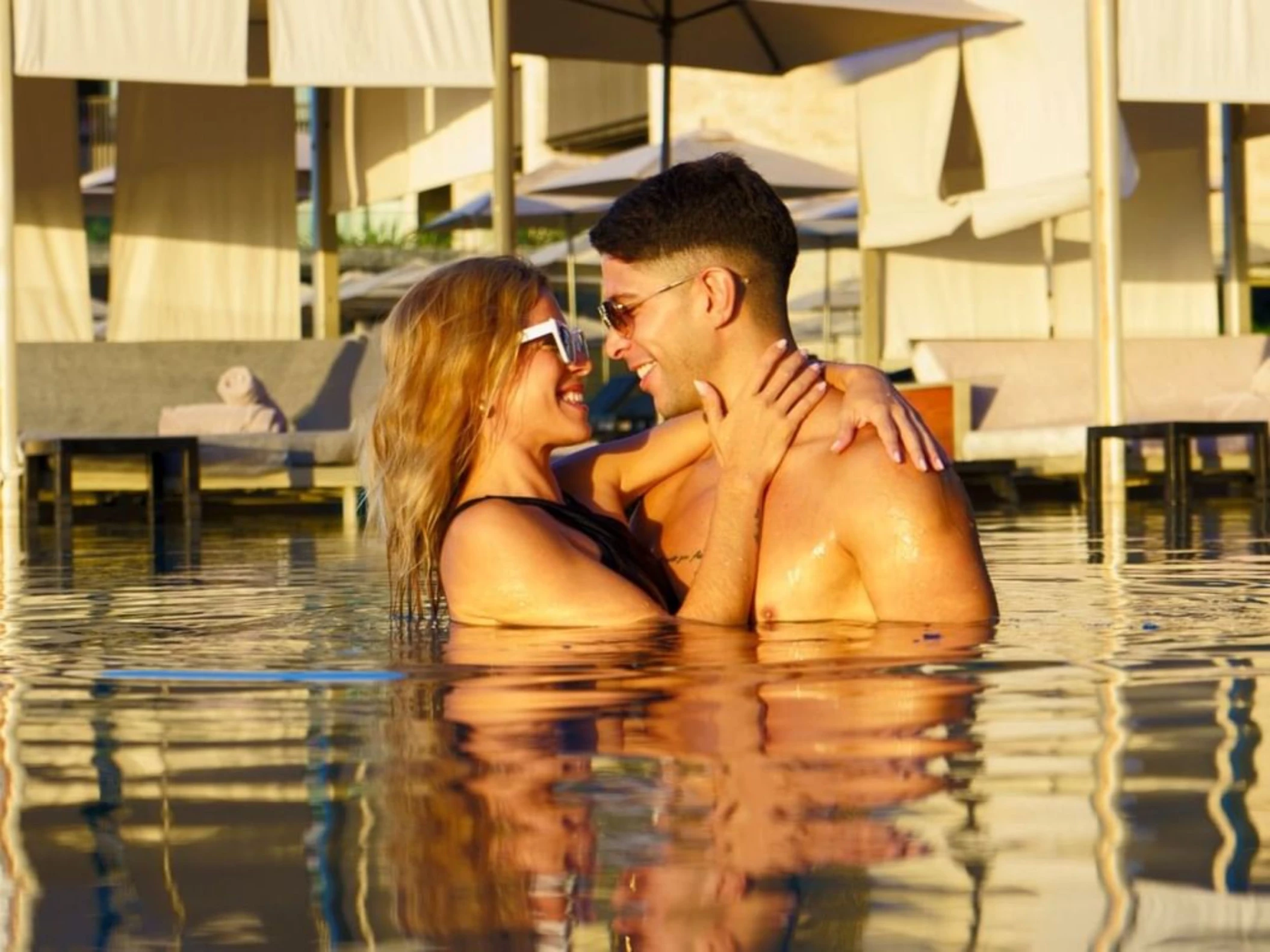 couple in the pool at Devossion by Live Aqua Playa del Carmen