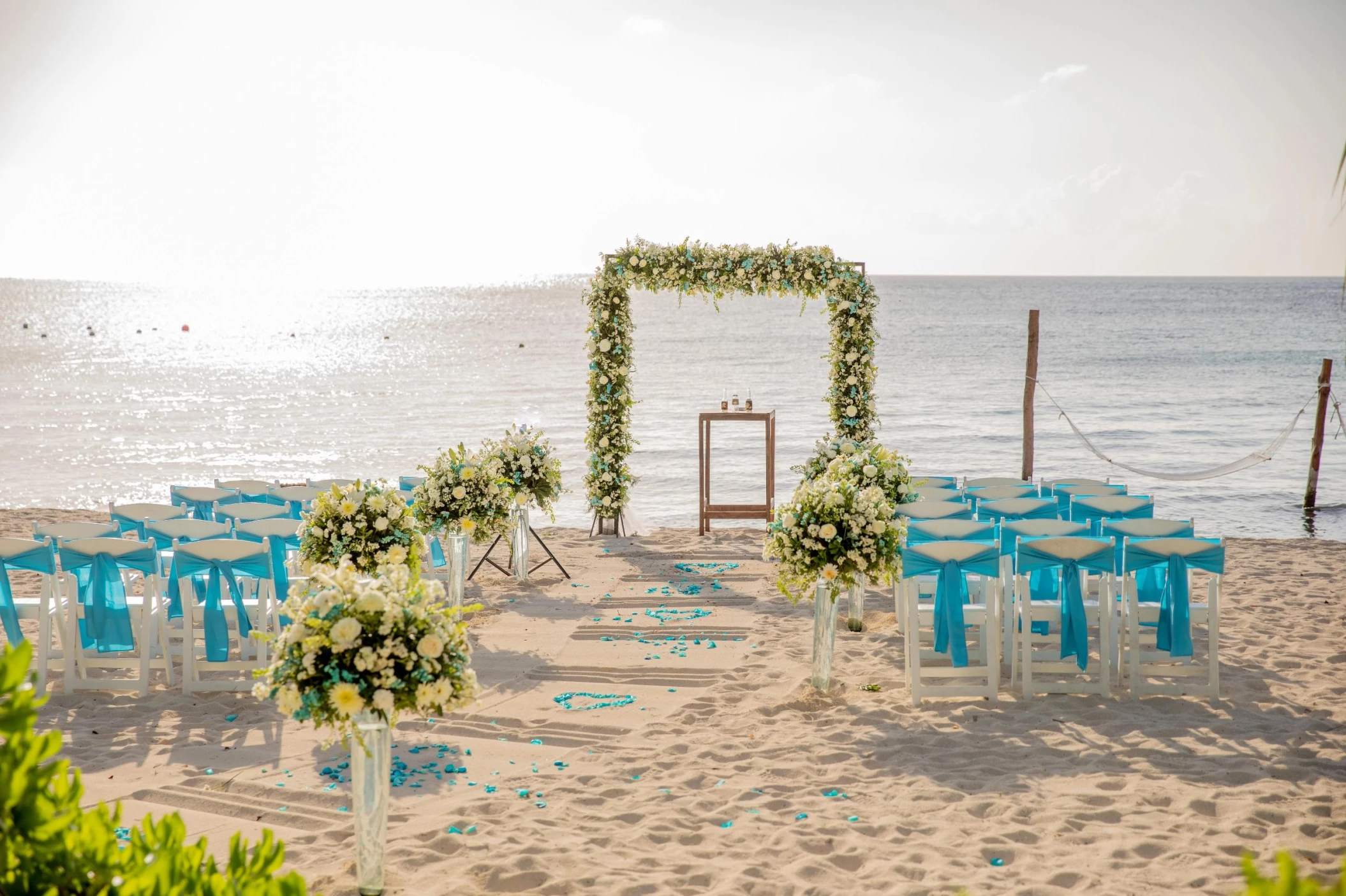 beach wedding setup at Dreams Cozumel Cape Resort & Spa