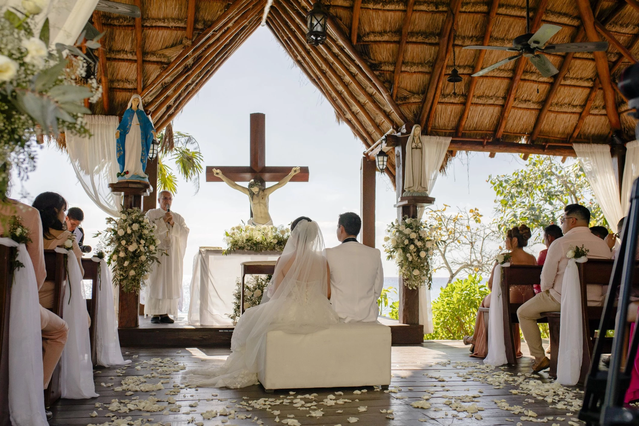 bride and groom at the catholic chapel at dreams cozumel cape resort