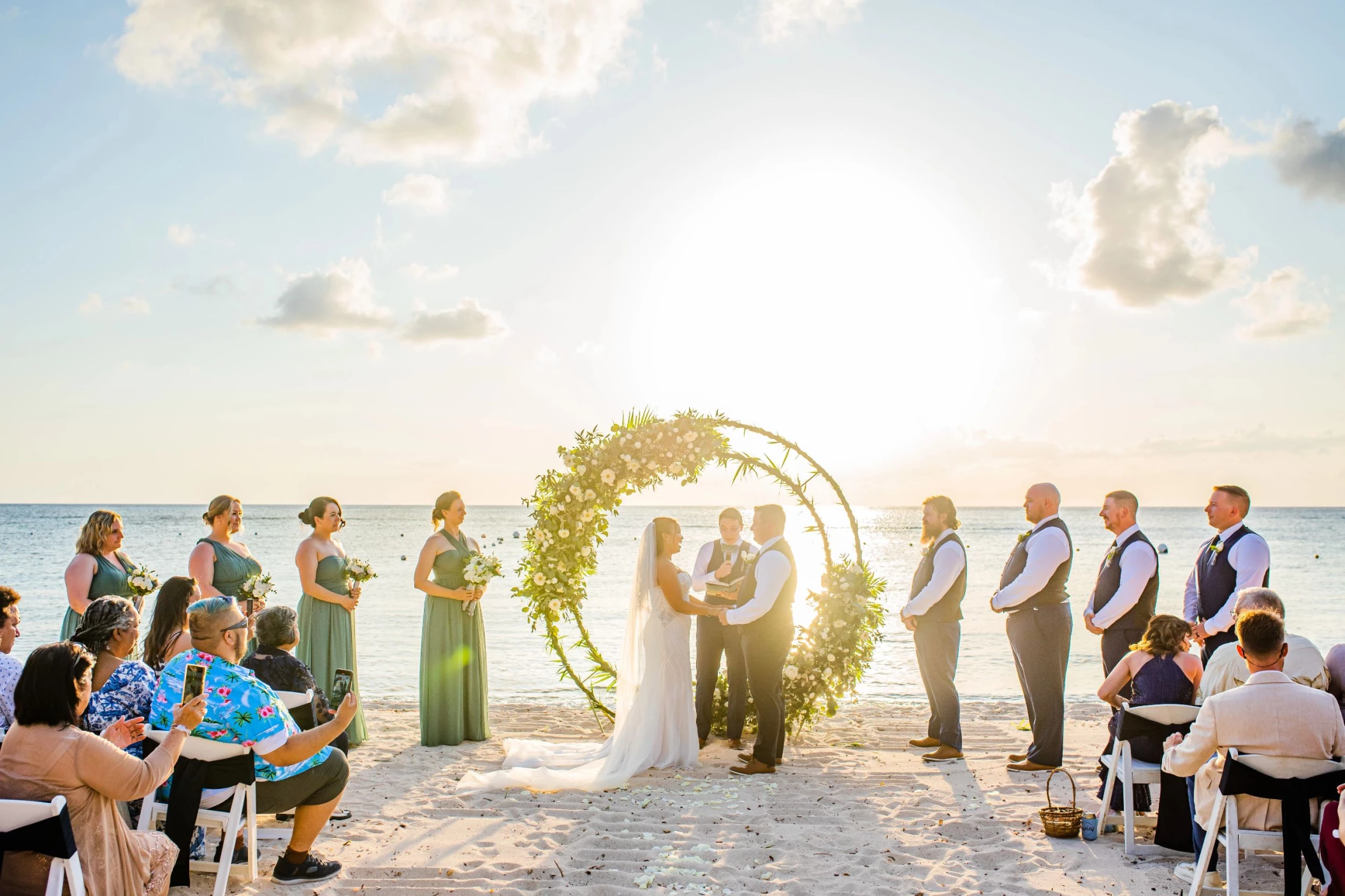 bride and groom and guests at the beach venue at Dreams Cozumel Cape Resort & Spa