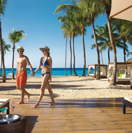 couple walking on the beach at Dreams Dominicus La Romana