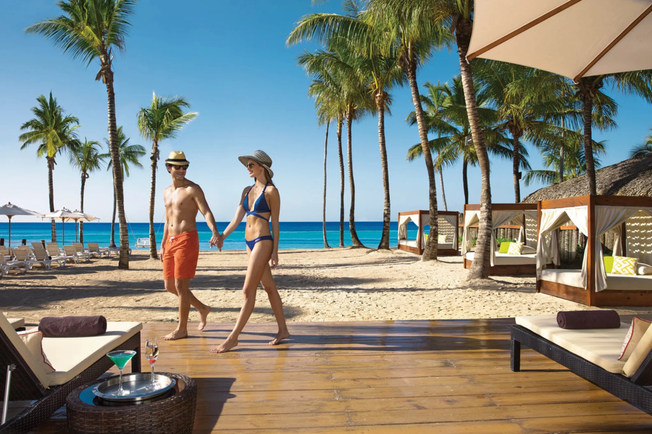 couple walking on the beach at Dreams Dominicus La Romana