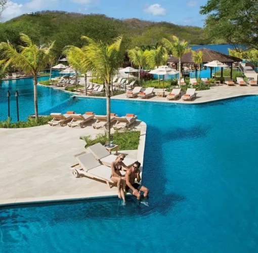 couple at the pool at Dreams Las Mareas