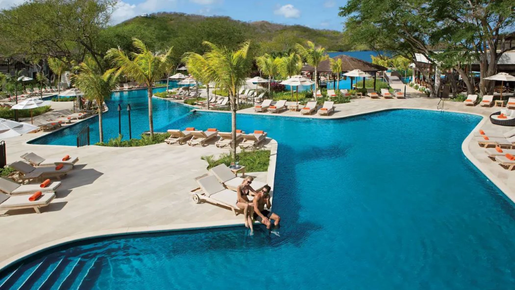 couple at the pool at Dreams Las Mareas