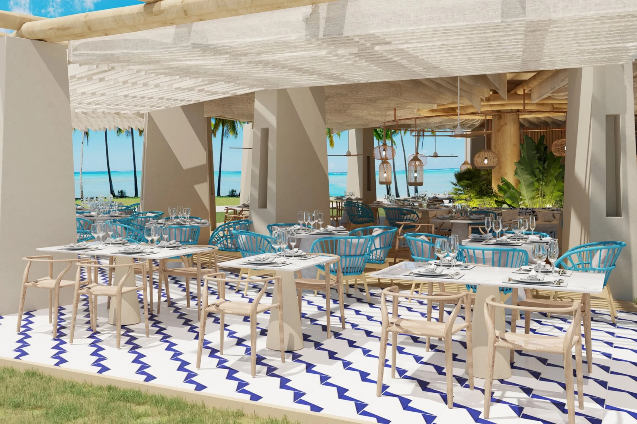The outdoor dining area of the Bluewater Grill restaurant, with ocean views, blue chairs, and a covered terrace.