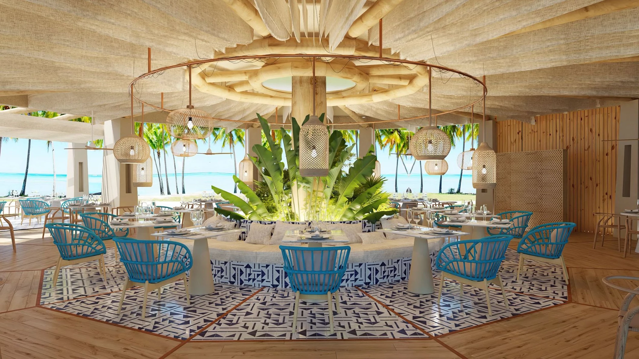 Interior of the Bluewater Grill restaurant, featuring light blue chairs, a circular booth, and ocean views.
