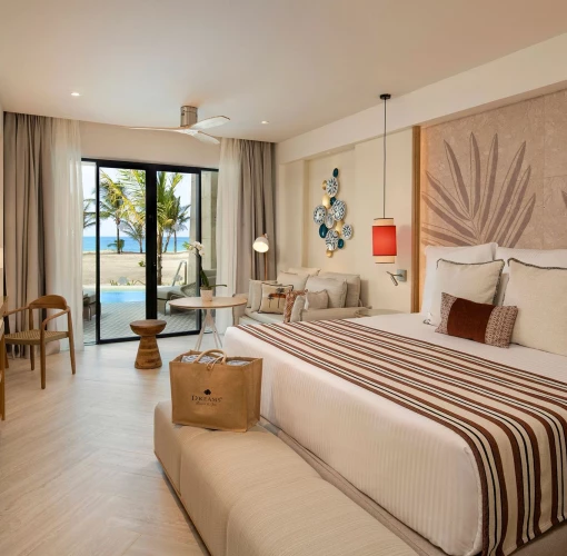 A preferred club junior suite featuring a king-sized bed and a private swim-out pool right outside the door.