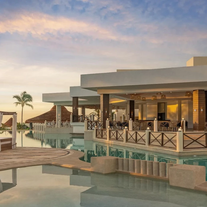main pool and poolside restaurant at Dreams Puerto Morelos Resort & Spa