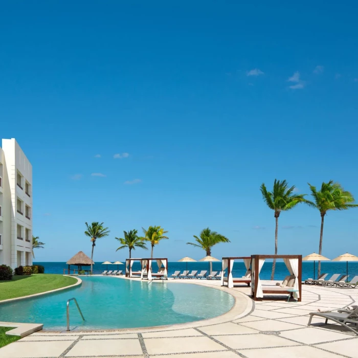 main pool and the resort buildings at Dreams Puerto Morelos Resort & Spa