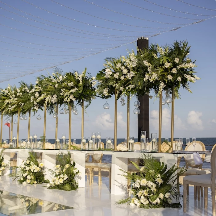 long wedding set-up on beach Secrets Riviera Cancun