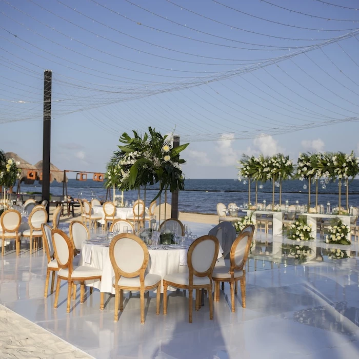 beach wedding set-up round table Secrets Riviera Cancun