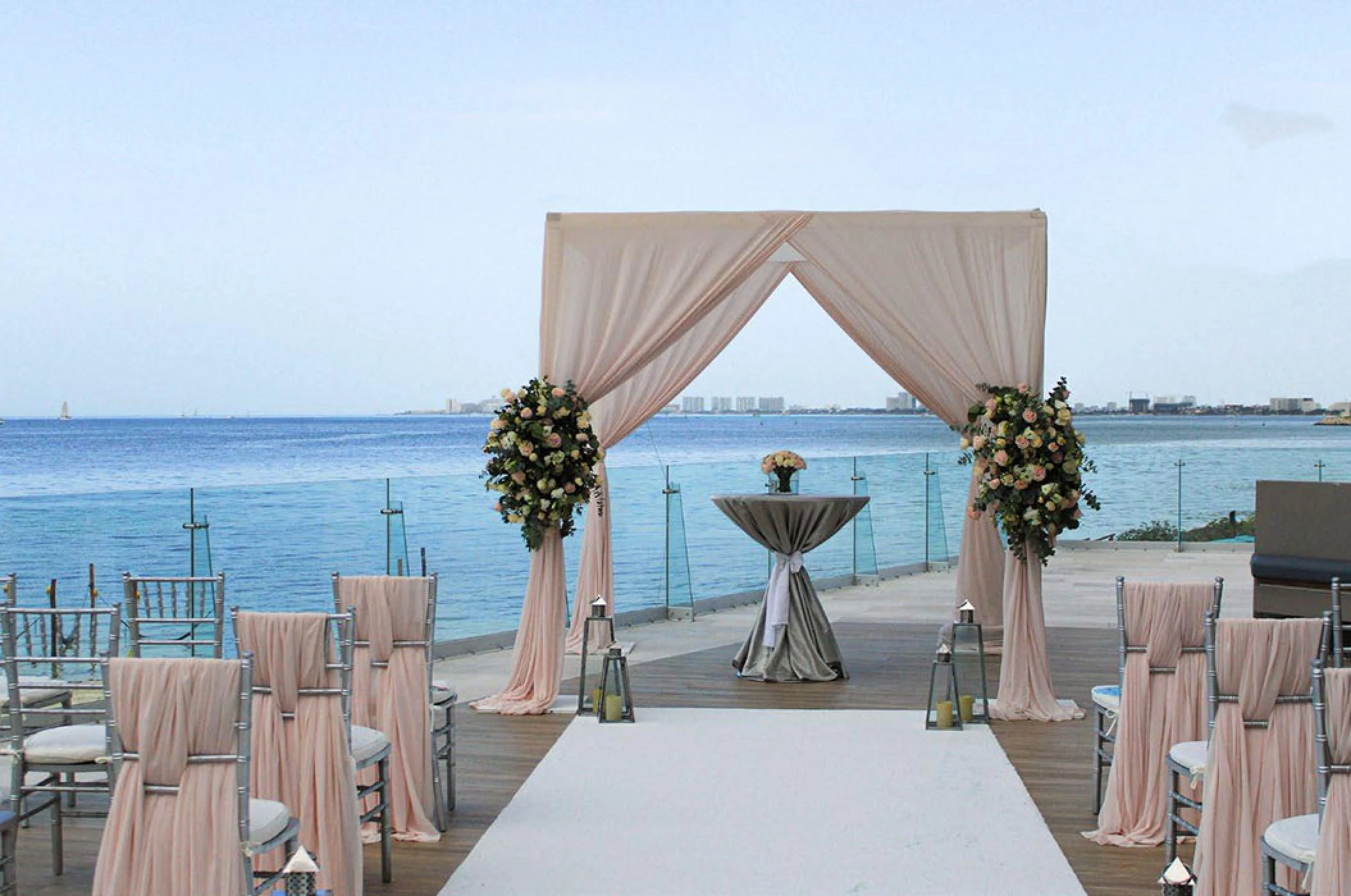 pool terrace with seating for weddings at Dreams Vista Cancun Golf and Spa