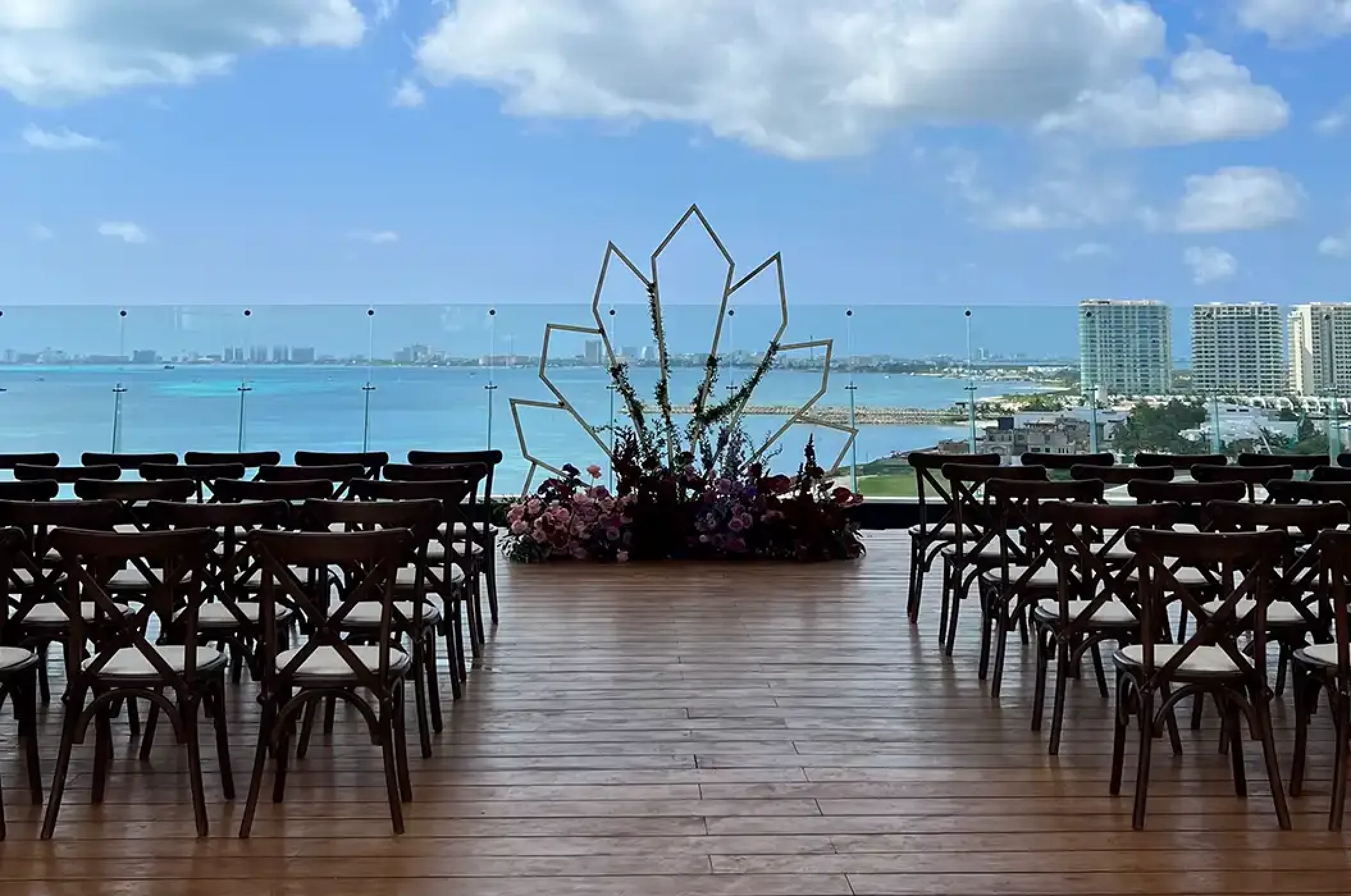 Terrace wedding venue overlooking ocean and golf atDreams Vista Cancun Golf and Spa