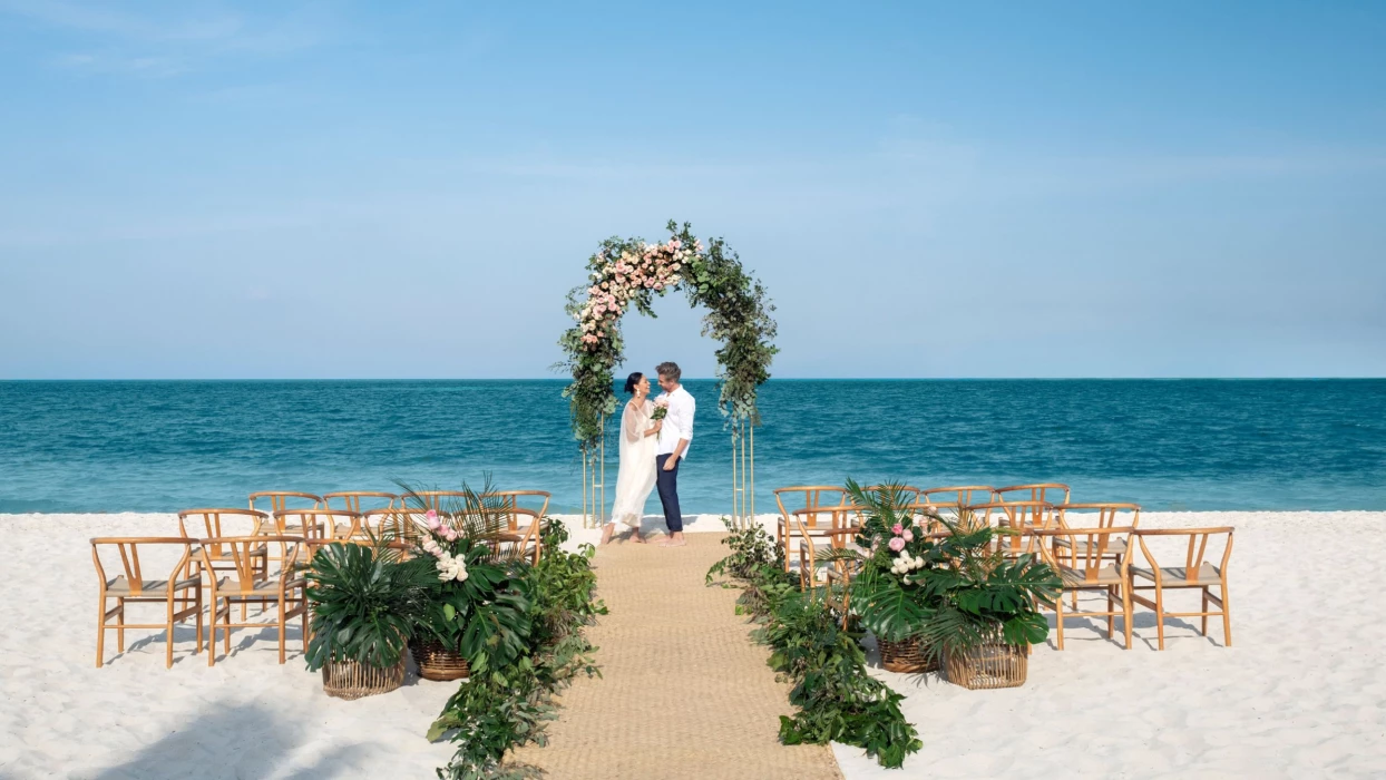 bride and groom on the beach at Excellence Coral Playa Mujeres