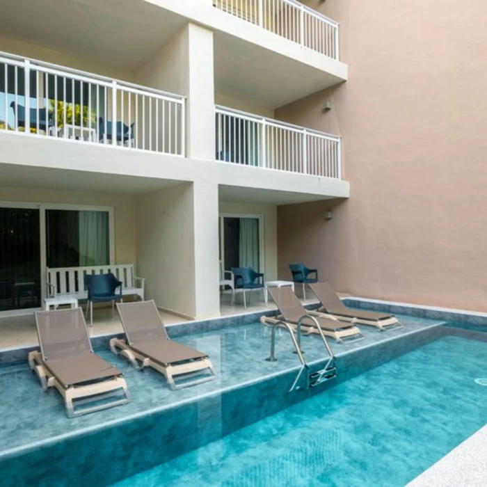 suite with plunge pool exterior at Fiesta Americana Cozumel