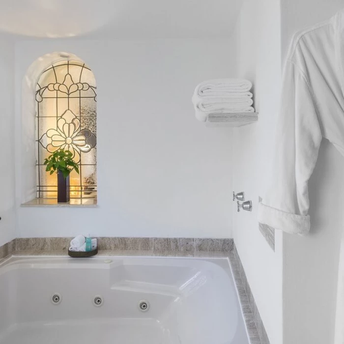 bathrobe and tub in suite at Grand Fiesta Americana Coral Beach Cancun