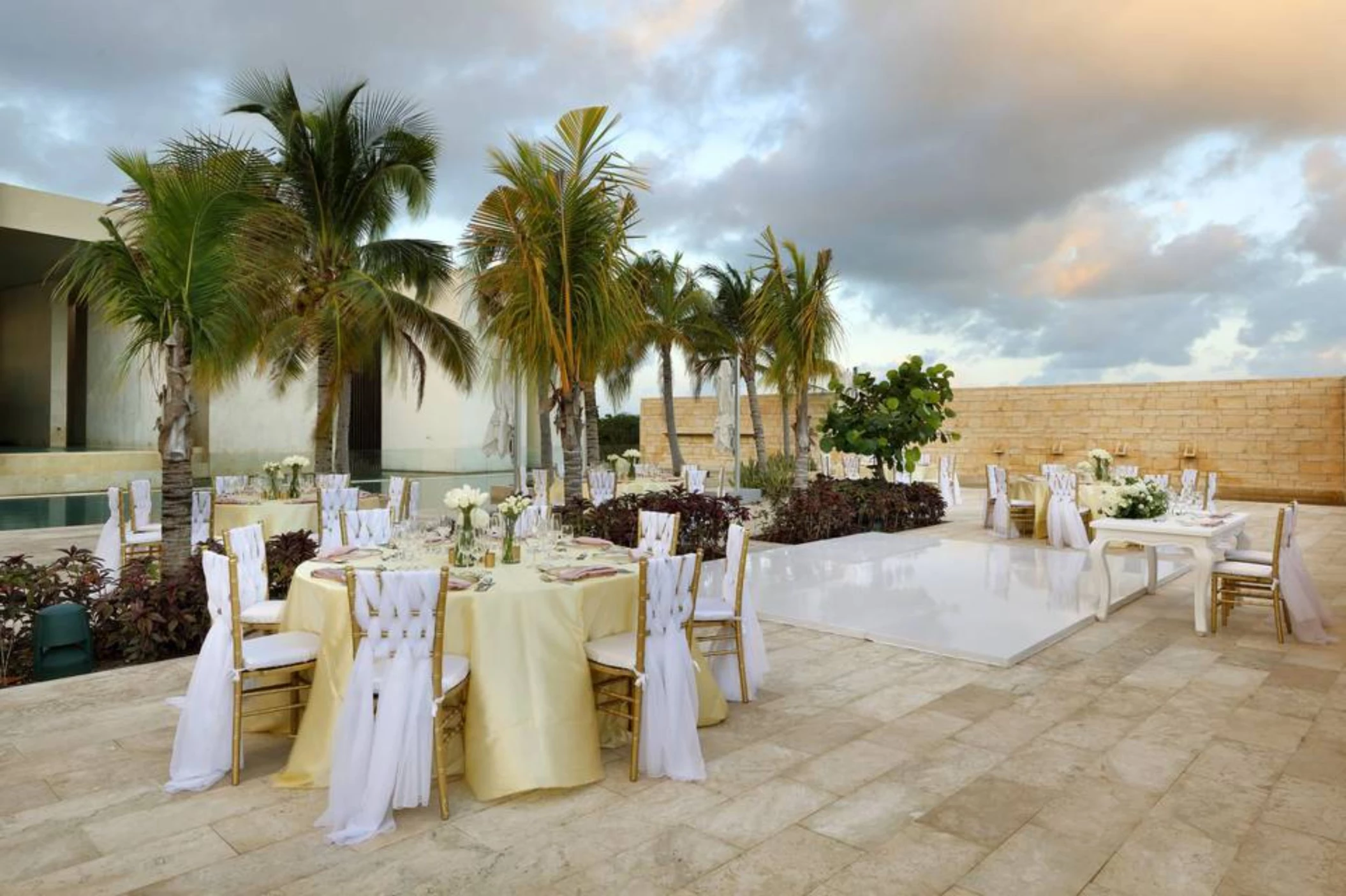 fizz pool terrace venue reception setup with dance floor at Grand Palladium Select Costa Mujeres