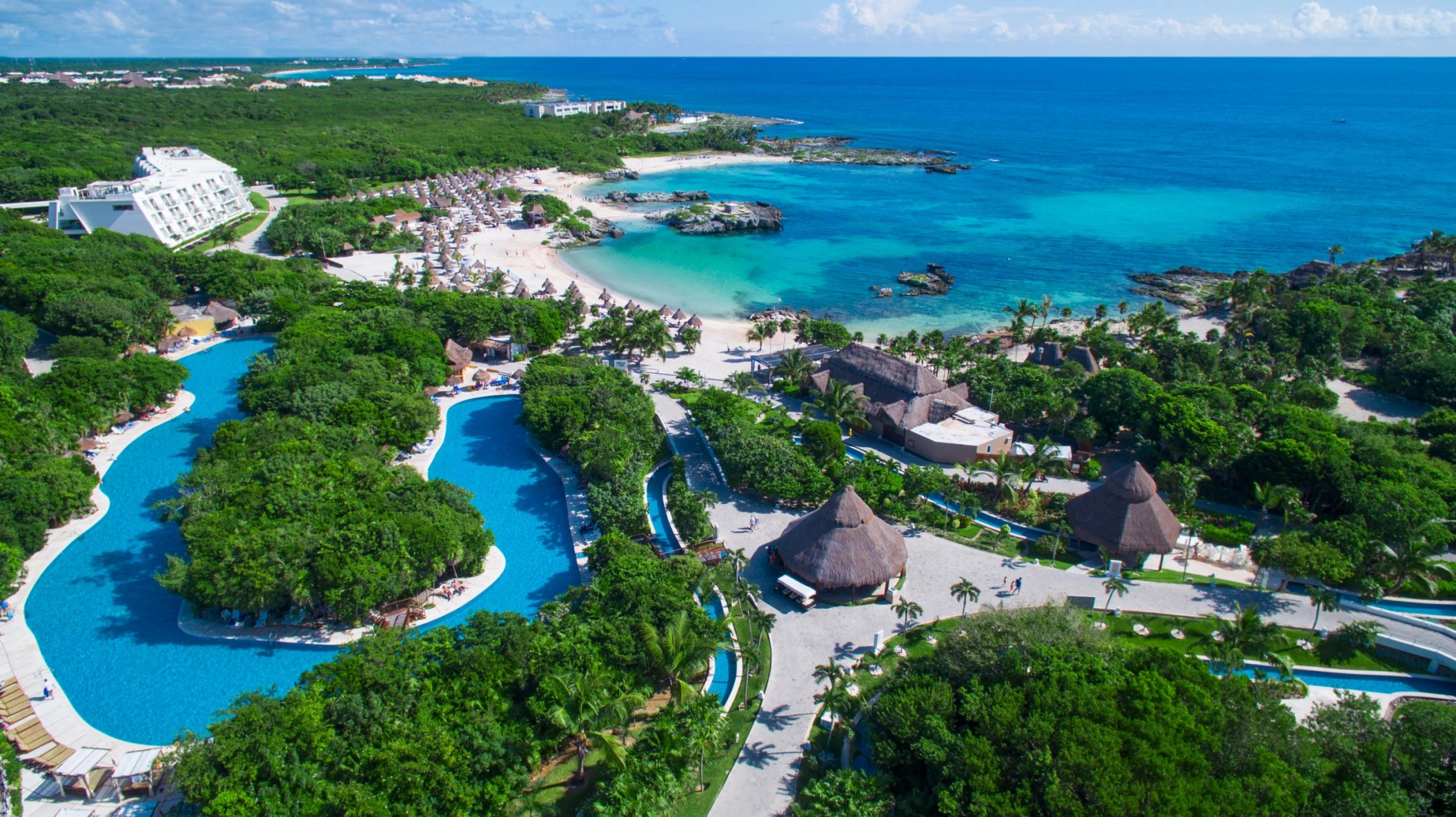 aerial view of Grand Sirenis Riviera Maya with its beach and lazy river and accommodations