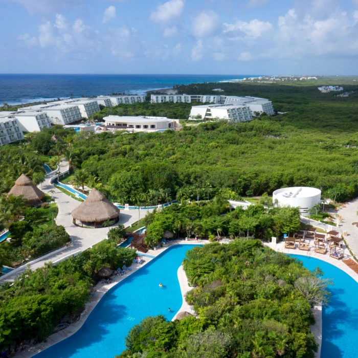 aerial view of the lazy river and resort buildings at Grand Sirenis Riviera Maya