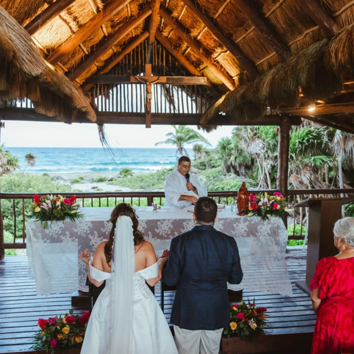 bride and groom and priest and guests at the chapel venue at Grand Sirenis Riviera Maya