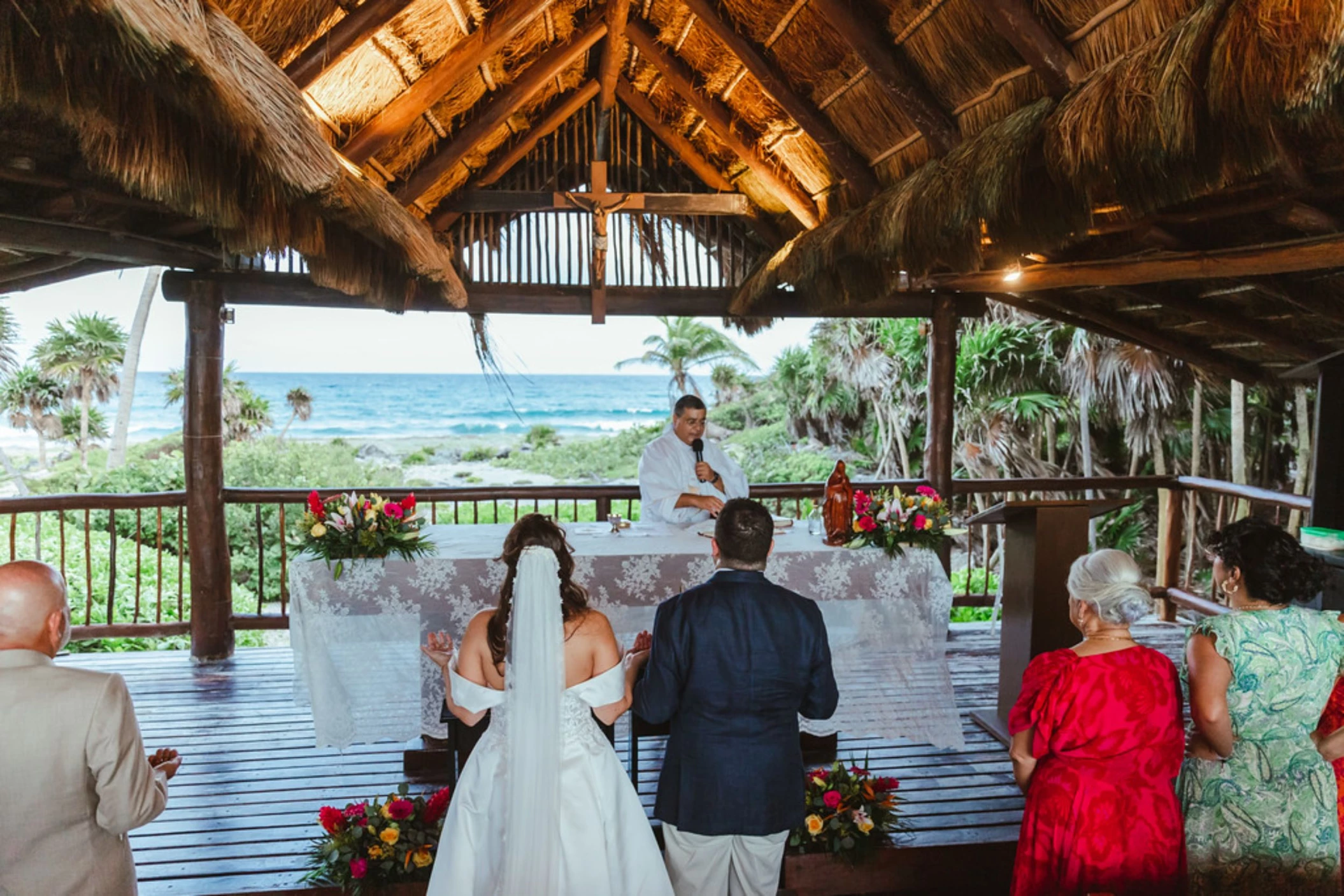 bride and groom and priest and guests at the chapel venue at Grand Sirenis Riviera Maya